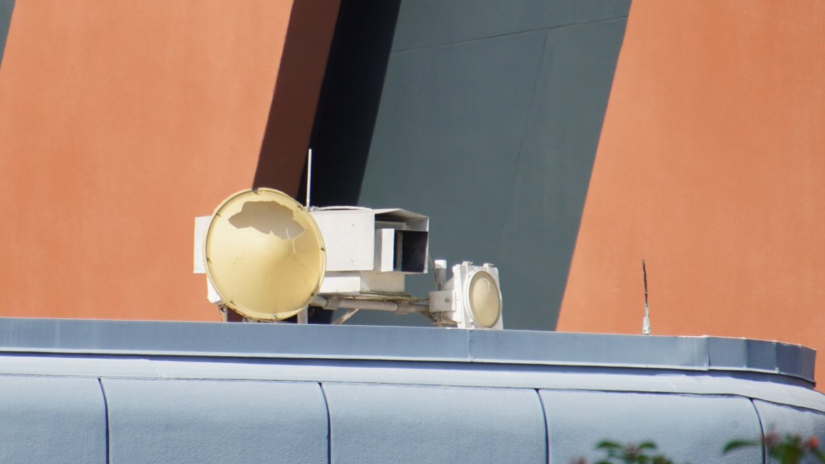 VIP room of former Epcot Horizons pavilion had a video "window" with robotic control of a rooftop camera, and a camera facing the pavilion. Current state of of the pavilion-facing apparatus.