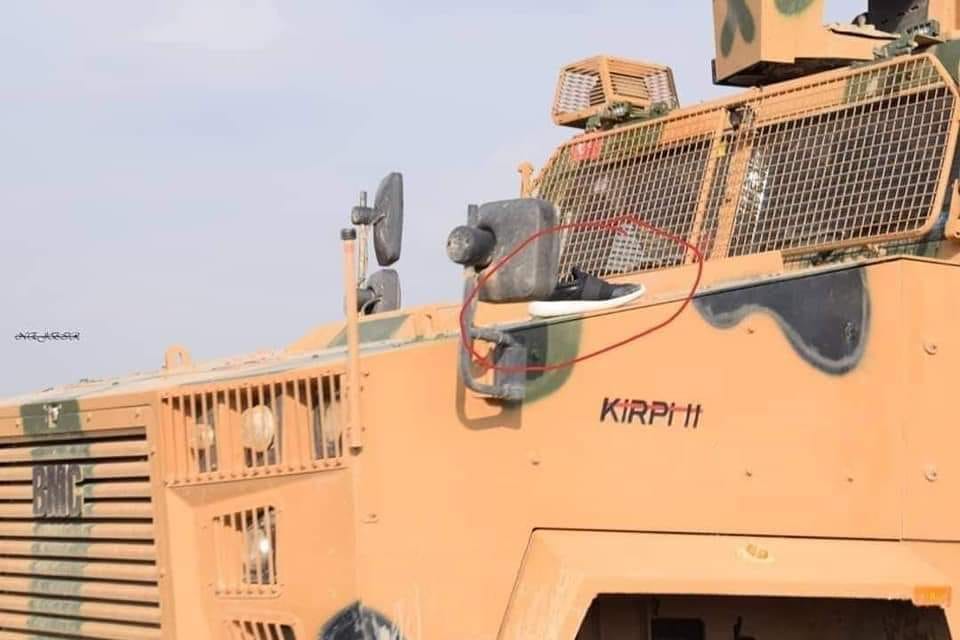 vvanwilgenburg's tweet photo. Young man from Amude calls on international community to return his right shoe. It got stuck on a Turkish armored vehicle https://t.co/klDgnPXdch