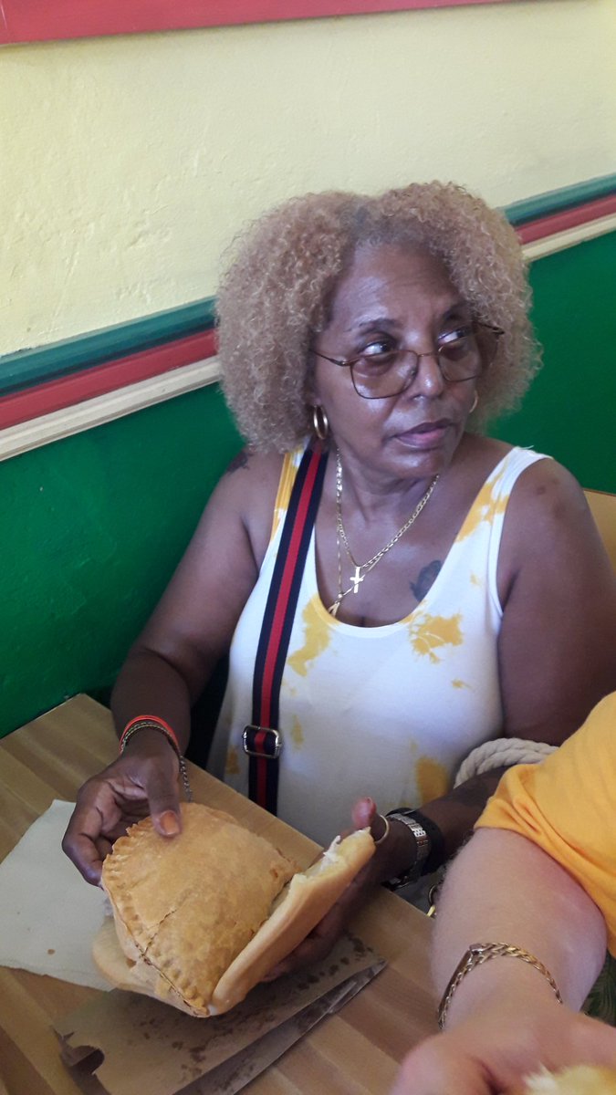 Did I get it right?! You sure did! Our #FalmouthFoodTour guest from #RiuReggaeMontegoBay is handling her patty and cocobread like a pro! #EatLikeALocal #TasteJamaica #AuthenticJamaica #LunchAndLearn #foodiefun #foodporn #thingstodoinFalmouth #FalmouthJamaica #thisisjamaica