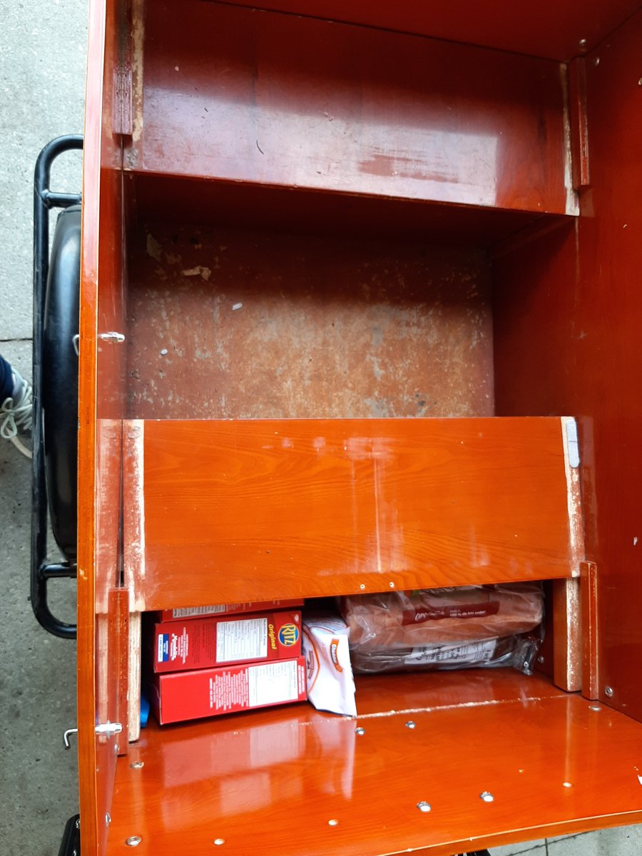Under the bench storage hold some groceries.