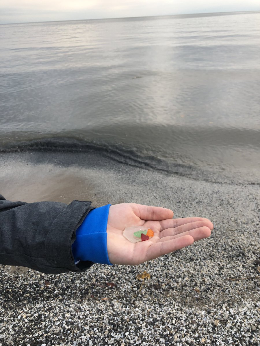 alibrarian's tweet photo. Beach glass! #RochesterNY #rocfireonice Break between games. Let’s see if finding orange glass for the first time brings luck. #hockey https://t.co/q8vKD0lkVa