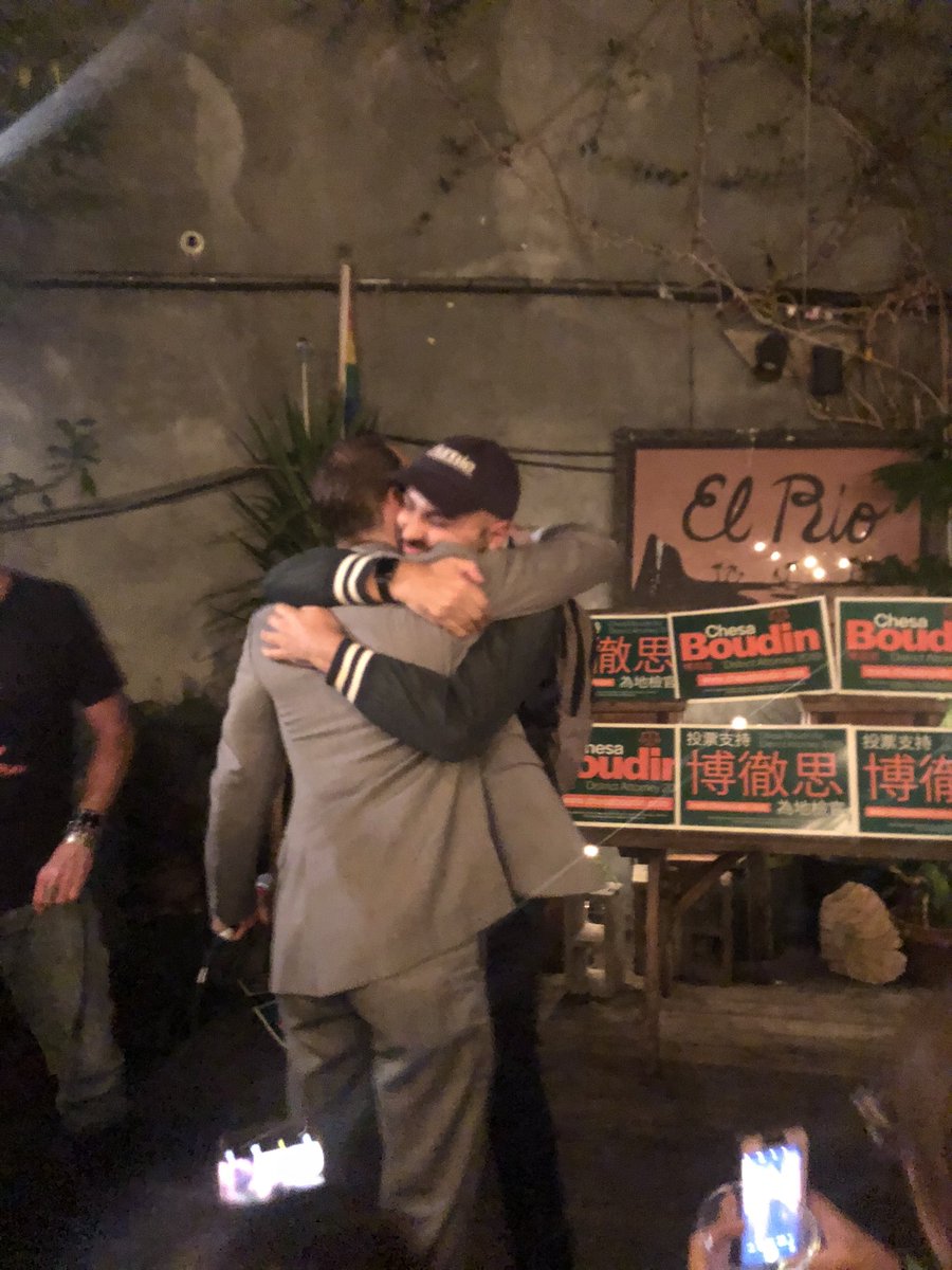 Brandon Harami hugs Chesa Boudin ‬at his victory party at El Rio