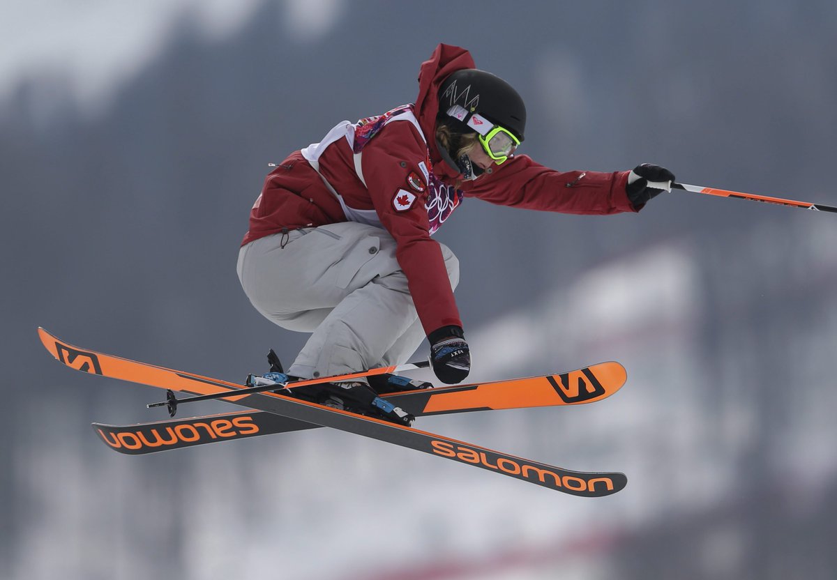 Canada's Dara Howell takes a jump during the women's freestyle skiing slopestyle final at the Rosa Khutor Extreme Park, at the 2014 Winter Olympics, Tuesday, Feb. 11, 2014, in Krasnaya Polyana, Russia. (AP Photo/Sergei Grits)