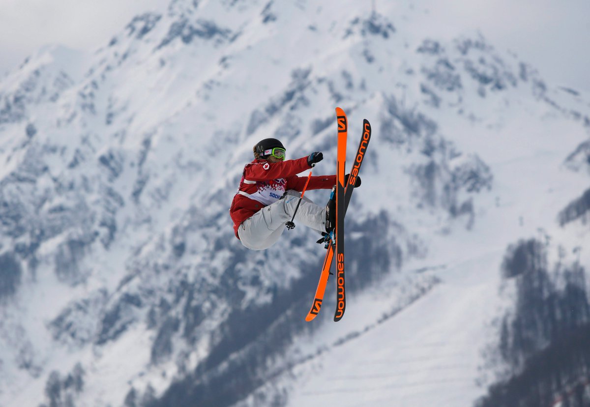 Canada's Dara Howell takes a jump during the women's freestyle skiing slopestyle final at the Rosa Khutor Extreme Park, at the 2014 Winter Olympics, Tuesday, Feb. 11, 2014, in Krasnaya Polyana, Russia. (AP Photo/Sergei Grits)