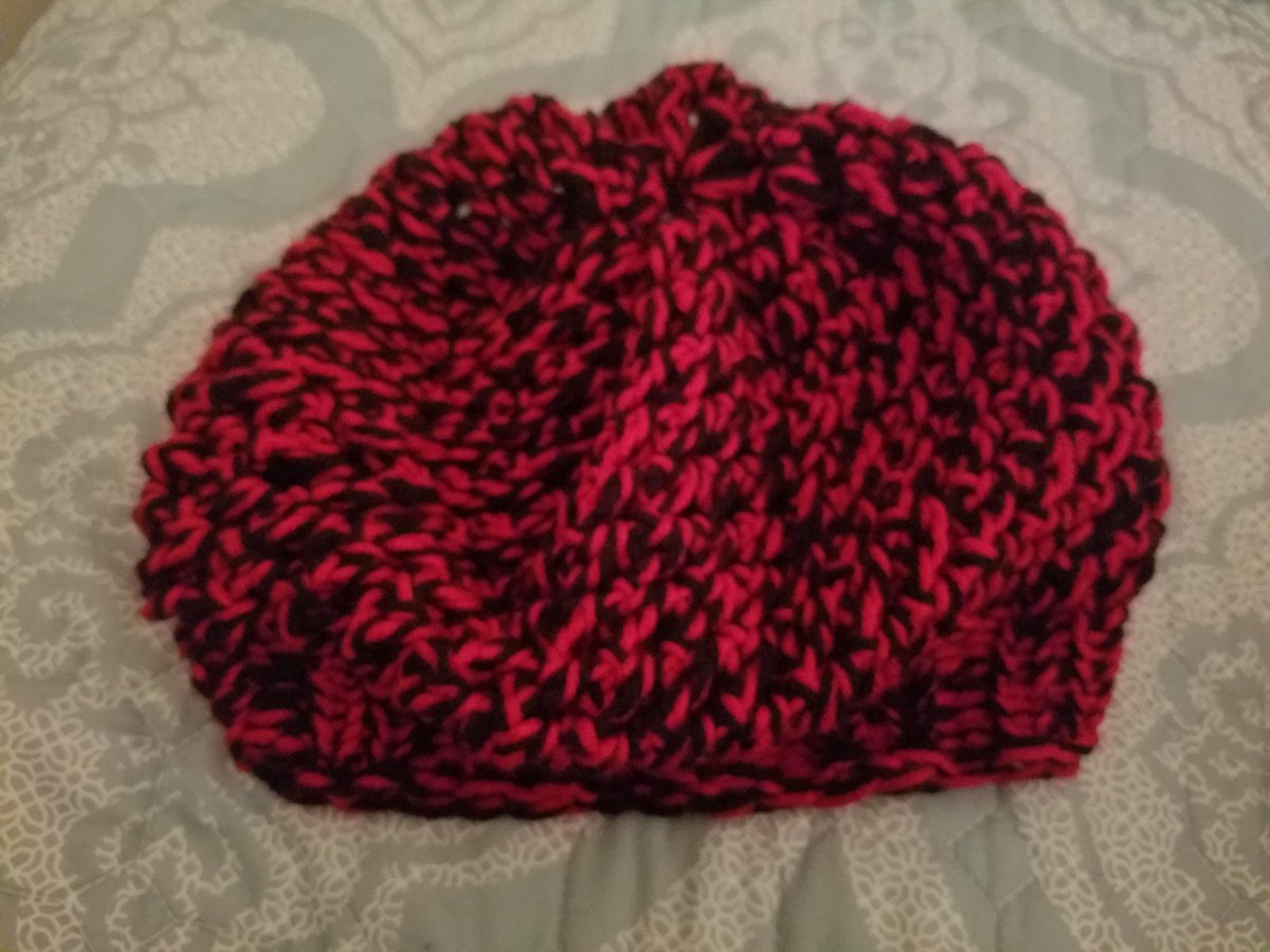 A bonny hat to go with my new winter coat! The hat was made with loom and red & black yarn seen in the above photo.