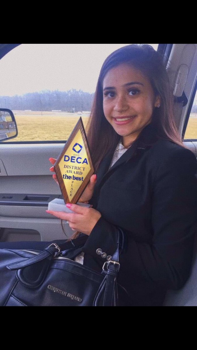 Deca month day 4: Your best DECA selfie. Junior Bel Nataran, 3 year member with her award she won at districts.