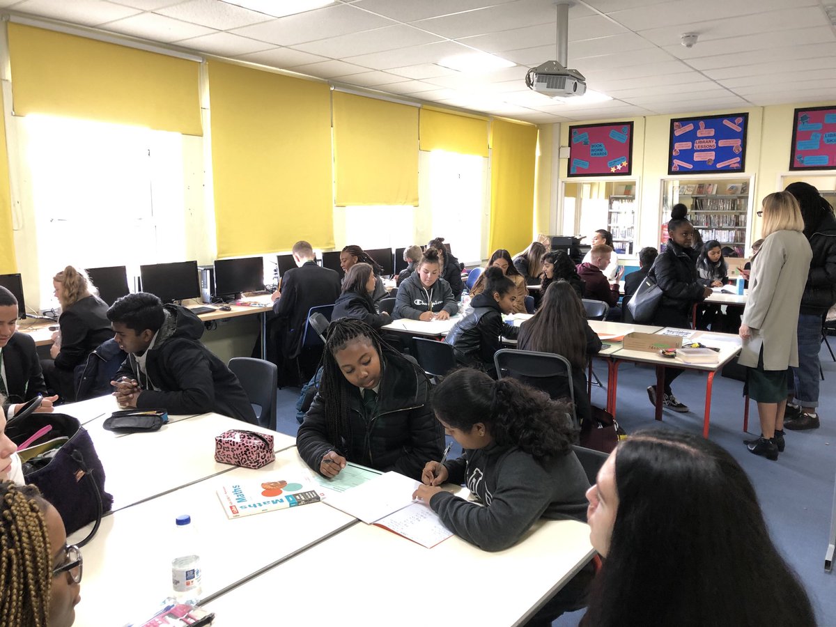 Sixth Form learning leaders helping Year 11 pupils with their studies.