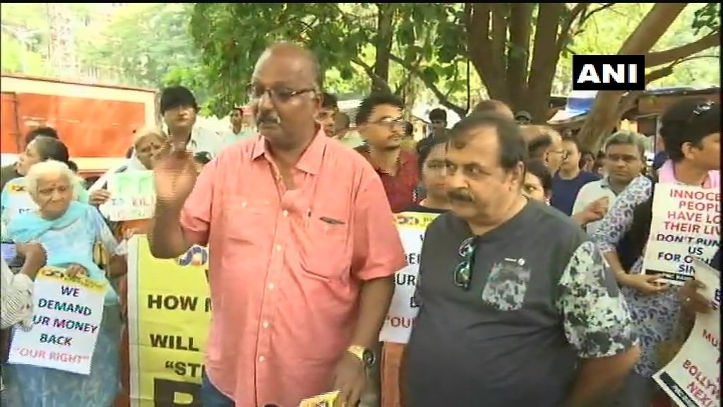 ANI's tweet photo. Maharashtra: Punjab and Maharashtra Co-operative (PMC) Bank depositors protest outside Reserve Bank of India (RBI) office in Mumbai. https://t.co/RXxp0qGTEP