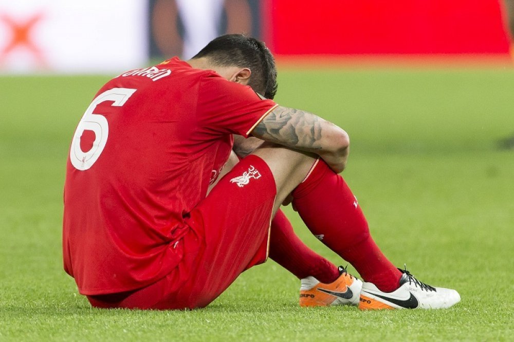 paddypower's tweet photo. A dejected Dejan Lovren sits on the Villa Park turf after his error cost the Under 16 team a place in the Carabao Cup semi-final while all his friends are in Qatar at the Club World Cup. https://t.co/9WsSv0UP3D