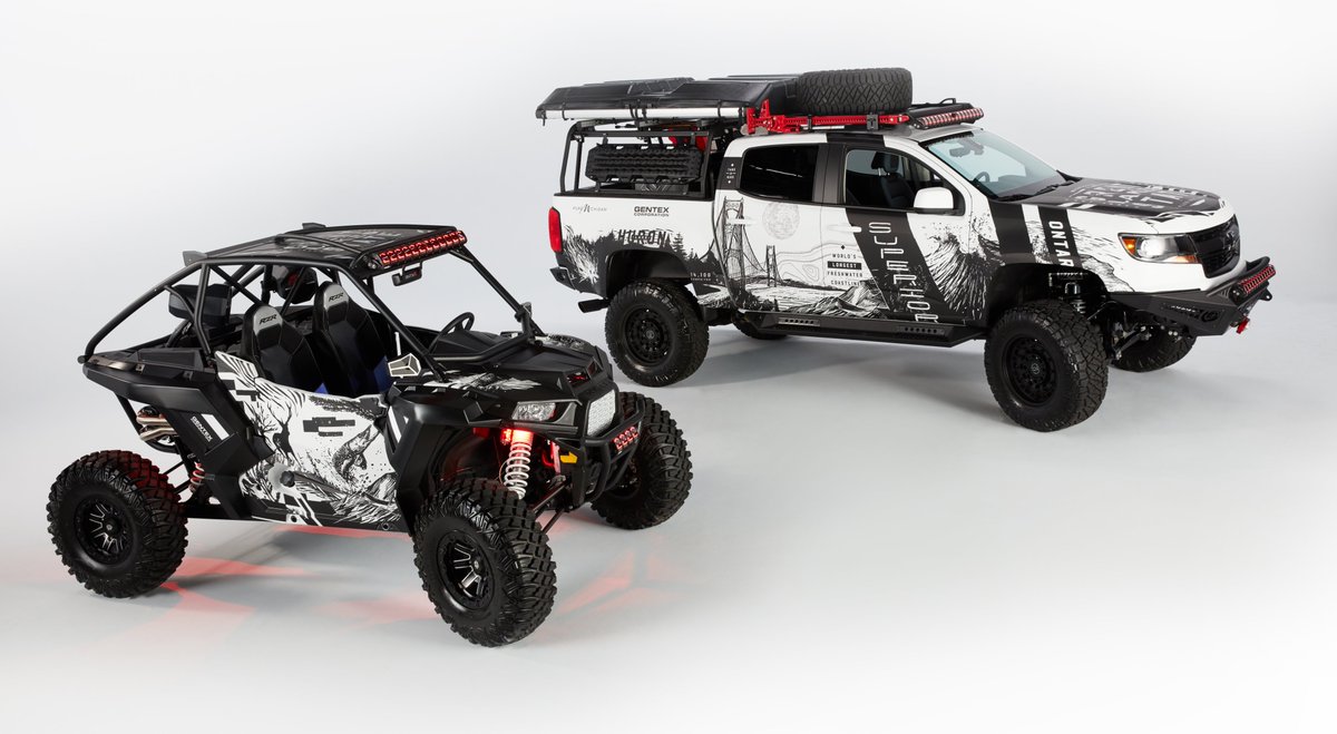 GentexCorp's tweet photo. If you love off-roading, stop by the #Gentex booth @SEMASHOW. This Polaris #RZR features a SmartBeam controlled light bar, R-Series #FDM, and a #Michigan-themed Wrap. Plus, our heavily modified Chevy Colorado with more enhanced tech this year! #sema2019 #technology #automotive https://t.co/anPapR65am