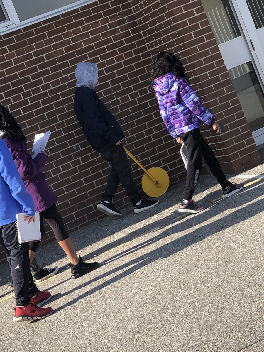 MsDudani's tweet photo. Using #trundlewheels to #measure and #map the exterior of @JosephAGibsonPS and then #calculate #area of a #complexshape. Fun and fresh air #math @YRDSBmath https://t.co/ZGGsjBGGXW