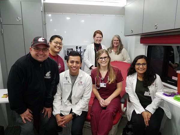 WSUNursing's tweet photo. Medicine, nursing and pharmacy students from WSU gave flu shots and health screenings in the Range Health mobile clinic in Spokane Valley last week. Health care works better when we work together. #GoCougs https://t.co/PWza5fTdO4