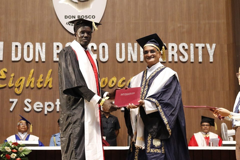 U18Alumni's tweet photo. Rialthin Danhier from #SouthSudan received #MBA degree award by VC. Dr. Stephen Mavely. - The 8th convocation of Don Bosco University.
#DBUGlobal
#University18
#ADBUConvocation2019 https://t.co/rZl0DKnx3L