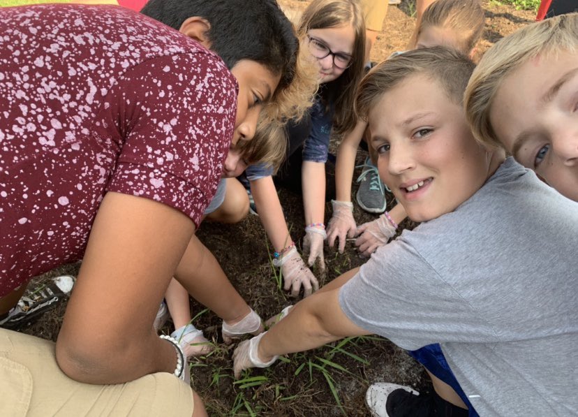 nc5service's tweet photo. Fifth grade has done an amazing job keeping the courtyard clean and watering the flowers around Noble Crossing!  #FifthGradeServiceProject https://t.co/BAb4BnOArm