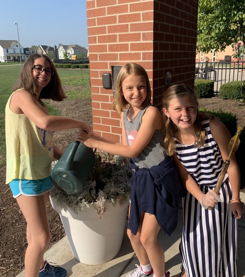 nc5service's tweet photo. Fifth grade has done an amazing job keeping the courtyard clean and watering the flowers around Noble Crossing!  #FifthGradeServiceProject https://t.co/BAb4BnOArm