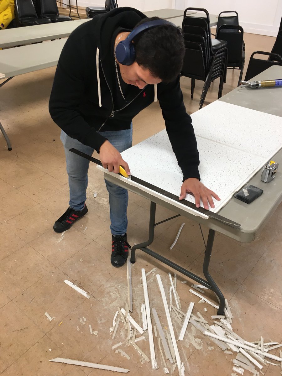 TQonstruction's tweet photo. Math standards in CTE.. Pertain to accuracy! Cutting in perimeter ceiling tiles.. and installing panel molding. Looks great! #teamphenomenal215 #cte https://t.co/I2SSEgAU3z