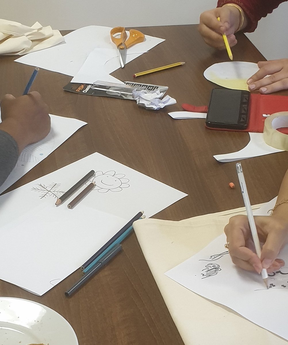 S_I_Manchester's tweet photo. A fantastic group session today. Everyone working together and sharing ideas for the designs on our aprons. #butterpillar #Soroptimists @MancWomensAid https://t.co/CxIQzNnTG3