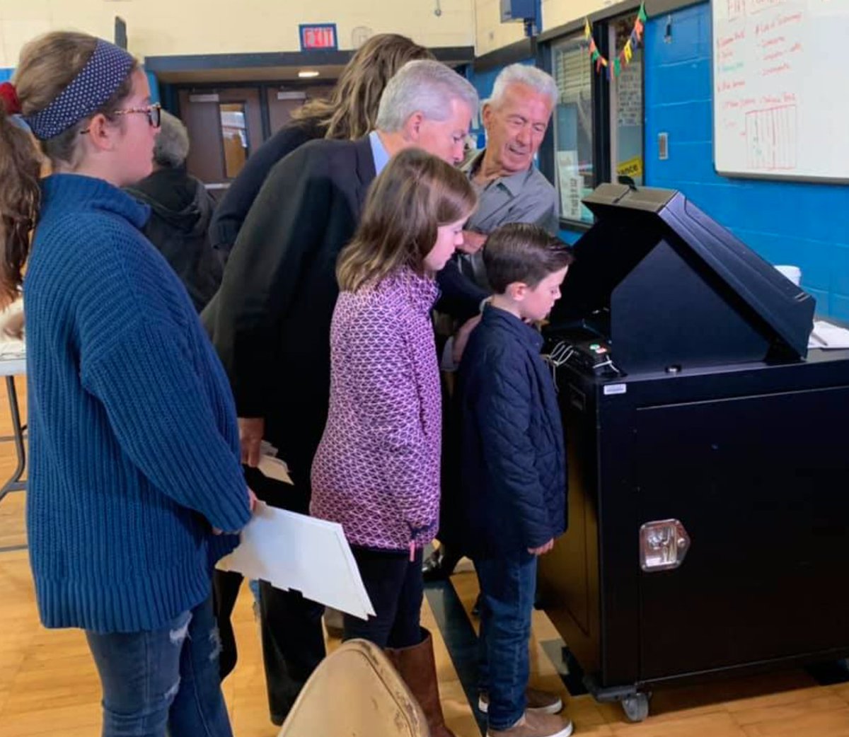 Curious to see who Steve Bellone chose for Suffolk County Executive, his family looks on. We think we know.