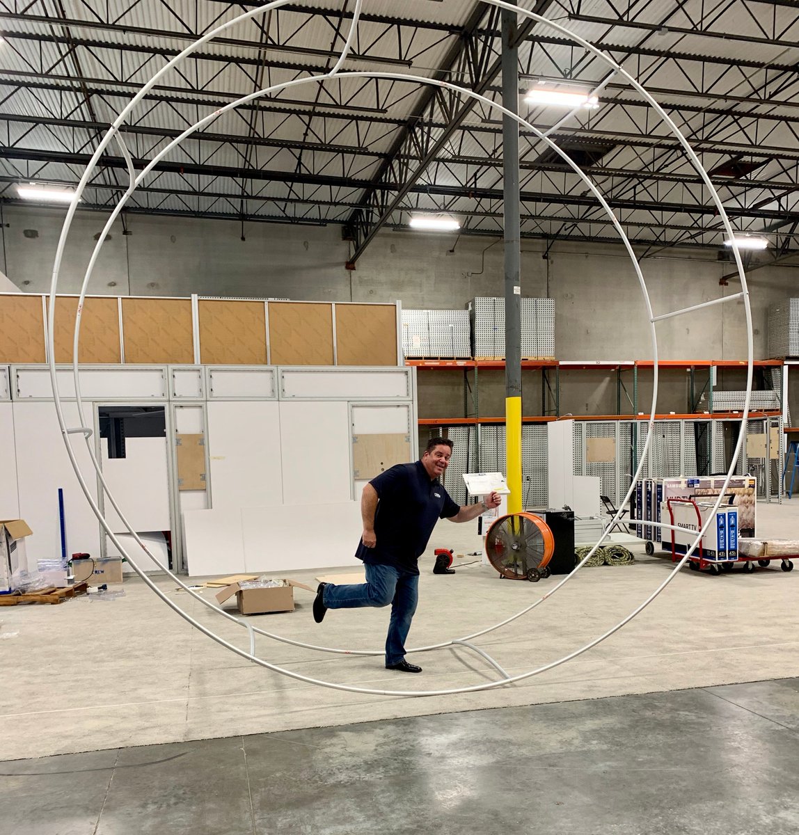 YourShowPartner's tweet image. He didn't even know there WAS a 'gerbil wheel test' for trade show hanging signs, but...whatever!... @tradeshowgriff is a team player. #newguy #YourShowPartner #tradeshows #worklifebalance