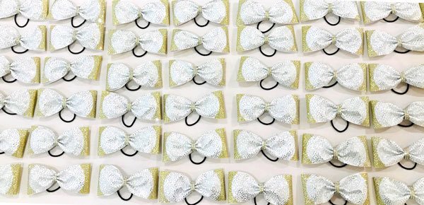 Confetti Gold, Rainbow White and 1000 Crystal Rhinestones! #cheerbows #cheercoach #cheerleadingcoach #cheerleaders