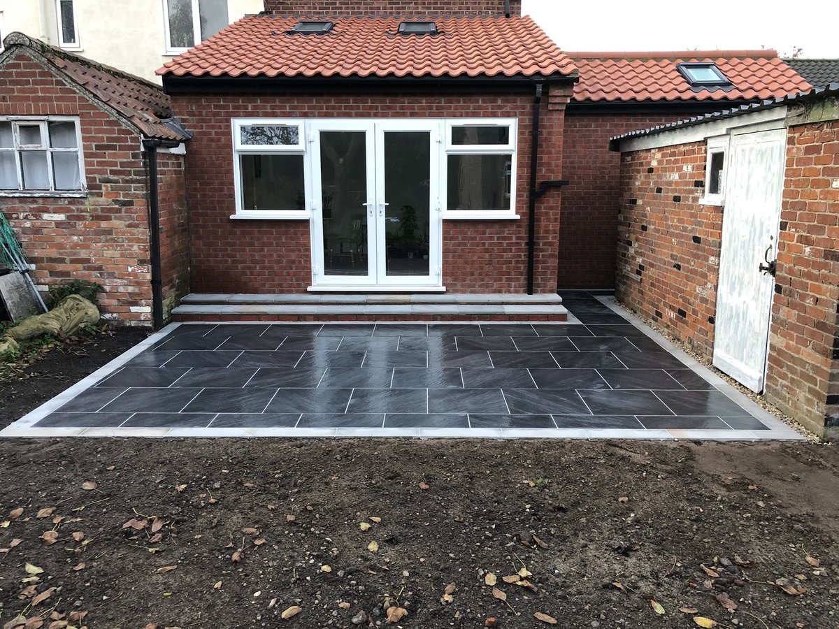 jdma_paving's tweet photo. Before and after photos of a new patio completed today in Bungay, Suffolk. @BradstoneUK mode profiled 6x6 porcelain in graphite with a light grey border and light grey bull nose steps #paving #bradstone #eastanglia #suffolk #jdma https://t.co/wuTXg13el6