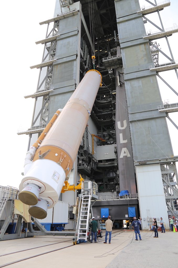 SpaceflightNow's tweet photo. The stacking of a United Launch Alliance Atlas 5 rocket this week at Cape Canaveral signals the start of a busy six-week campaign to ready ULA’s trusty workhorse launcher for its debut in a new human-rated configuration in mid-December. FULL STORY: https://t.co/lvsglX8PCI https://t.co/WApDF6Jjpv