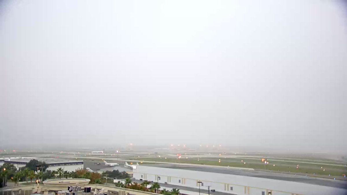 GrantGilmoreWX's tweet photo. Fog has kept our helicopter grounded this morning. Here's how it looks at @FlyTPA this morning. Yikes! #GotFog #10weather https://t.co/68AdGFOXB3