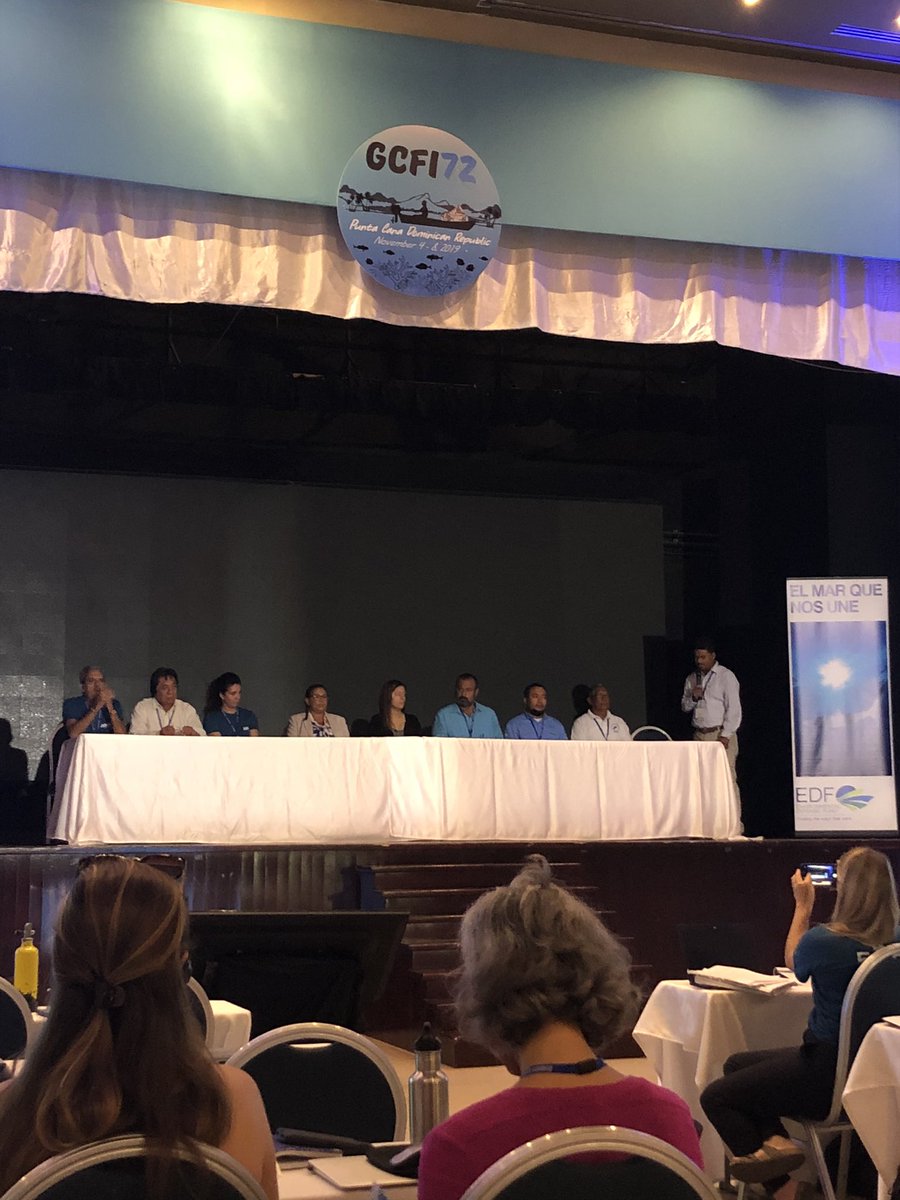 Panelists from Cuba, Belize, Dominican Republic, and Mexico sit at a table on stage at GCFI.