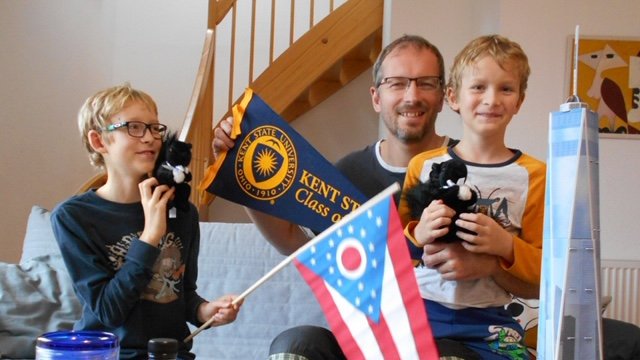 KentStateCIIE's tweet photo. It's souvenir time! 😆🥳 Former @kentstate @FulbrightTeach 
Teaching Excellence and Achievement Media Literacy participant Jan Matejec reunited with his family in #CzechRepublic 🇨🇿 and shares Kent State 🎁 souvenirs with his sons.🥰 🏠. https://t.co/AeW8yIotbd