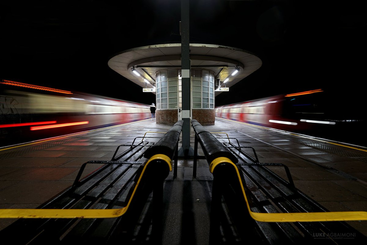 OPPOSITE DIRECTIONS PHOTO /3DOLLIS HILLThe train comes and goes on a rainy night at Dollis Hill station.  http://instagram.com/tubemapper&nbsp;  http://shop.tubemapper.com/Doliis-Hill-Station/Photography thread capturing trains leaving & arriving a London Underground station.THREAD