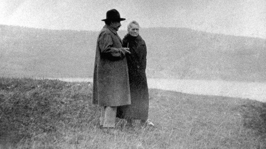 op109's tweet image. Scientists Albert Einstein and Marie Curie walk to Lake Léman, Geneva, Switzerland 1925