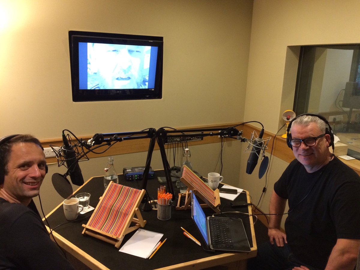 mark jenkin and mark kermode sitting a table with recording microphones 