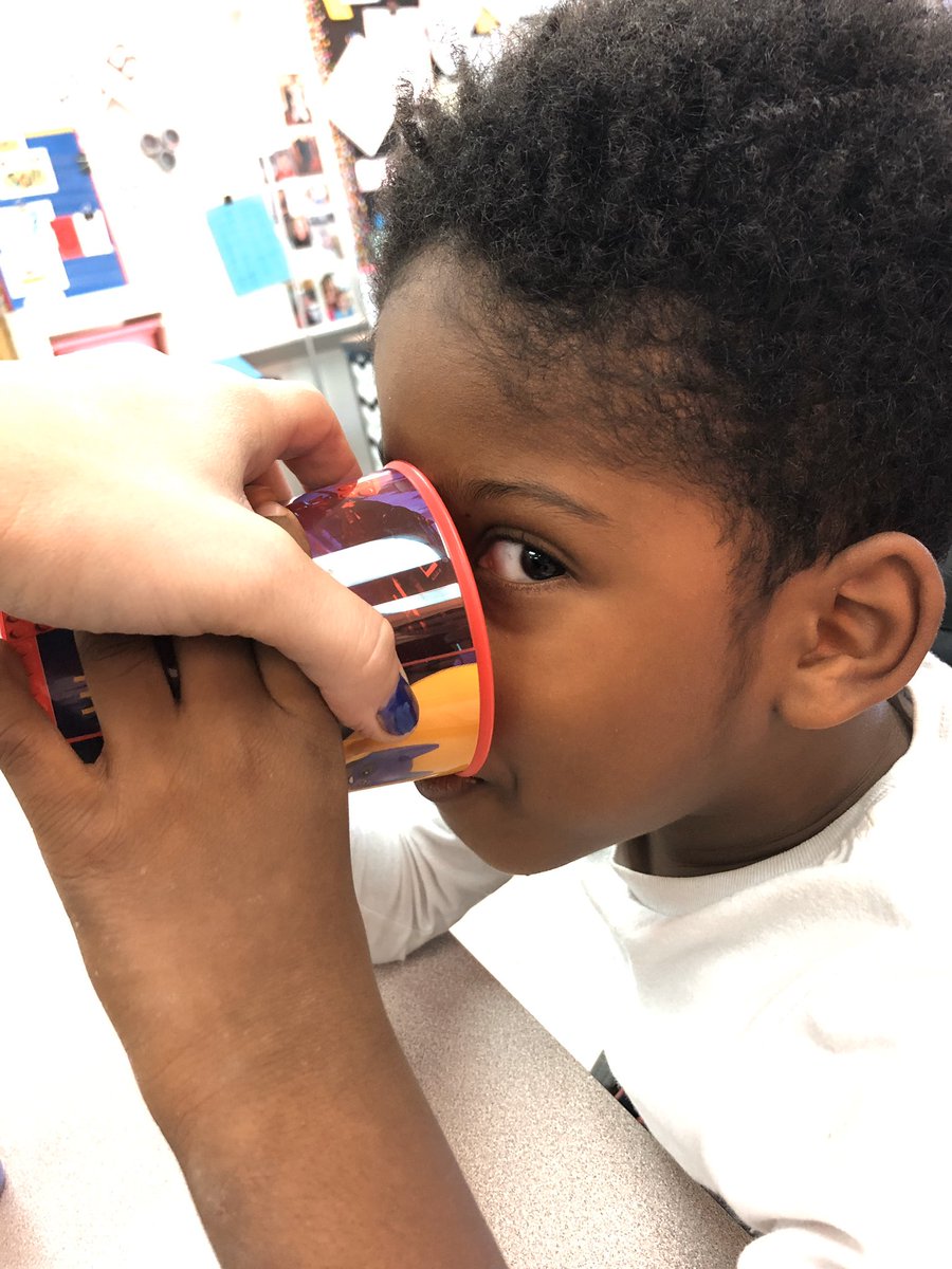 Cooperteachwsd's tweet image. Practicing drinking out of an open cup. Right now we are just drinking air :) the girls were great examples :) The best is how proud Zion is at himself #wearwduello