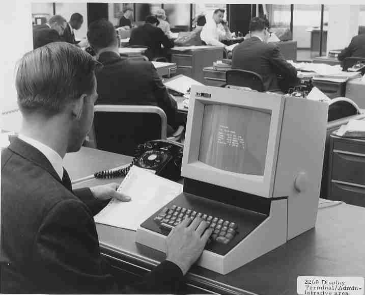 Man typing on an IBM 2260 terminal.
