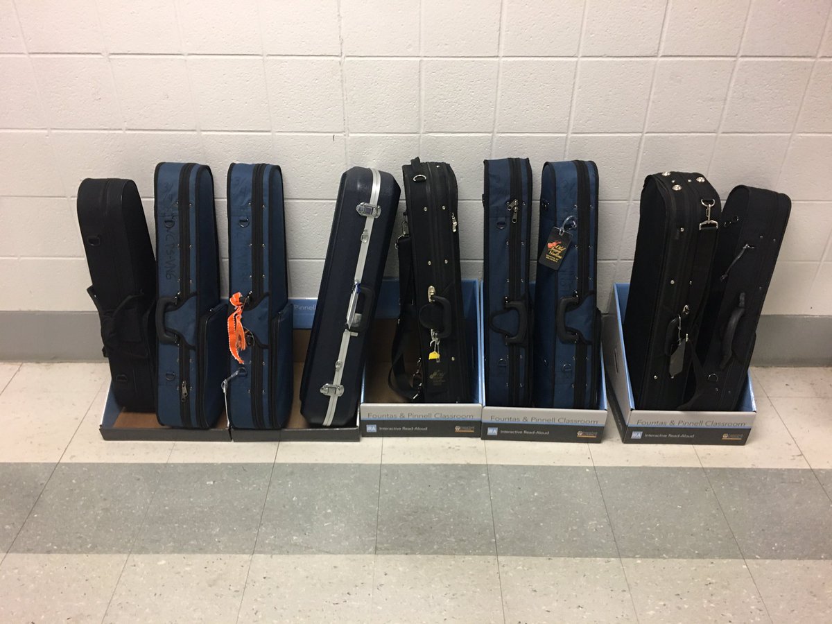 OrchestraWcms's tweet photo. Clever idea from my elementary feeder using old book displays for instrument wracks in the hall! https://t.co/v24wmd1KqX