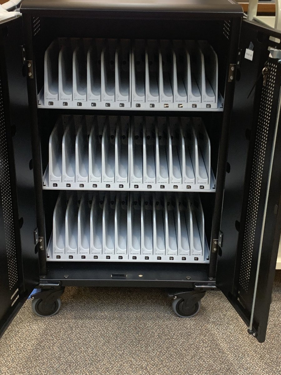 PEHSMedia's tweet photo. Empty student laptop cart = students are taking advantage of the opportunity provided by student ambassadors and the school board. #bengalpride #psd202 #laptopwaitlist https://t.co/n3nXlWFUm0