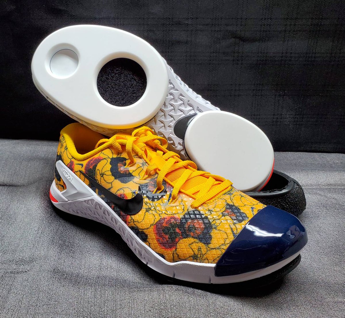 CurlingShoes's tweet photo. I understand this is upsetting. The last thing you thought you'd have to worry about today was whether your #curling shoe game was up to par. And then these cool, flowery #Metcons show up here and that's all you can think about. 1) Sorry. 2) Head to https://t.co/EkSM0H2yMa. https://t.co/H9Cl1LqDaU