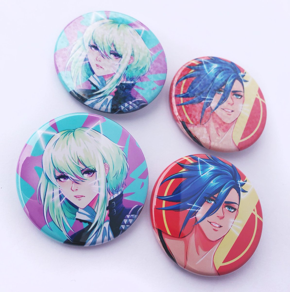 kawaiilo_ren's tweet photo. [rts💕] Online store is restocked! 
My Promare tie up charms and Promare &amp; FE3H buttons are now available! 
For US orders, you can use the code HOLIDAYSHIP for free shipping on orders over $25, and any order placed by Nov 30th will get 3 free stickers! ✨
https://t.co/FbDZbtXvx1 https://t.co/3utdfrD9kw