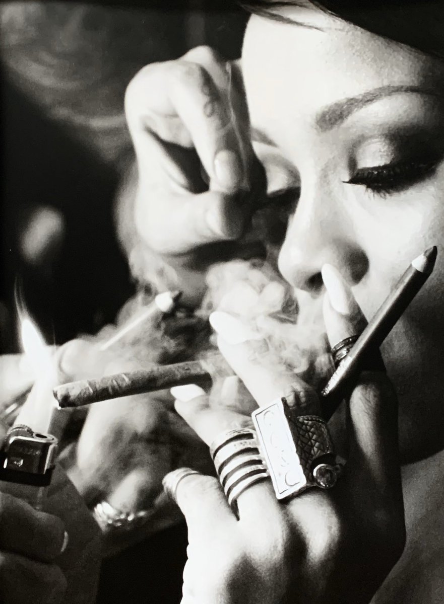 Rihanna smoking a blunt while getting her makeup done on the set of the “What Now” video shoot in Phuket, Thailand. Photographed by Dennis Leupold (2013)