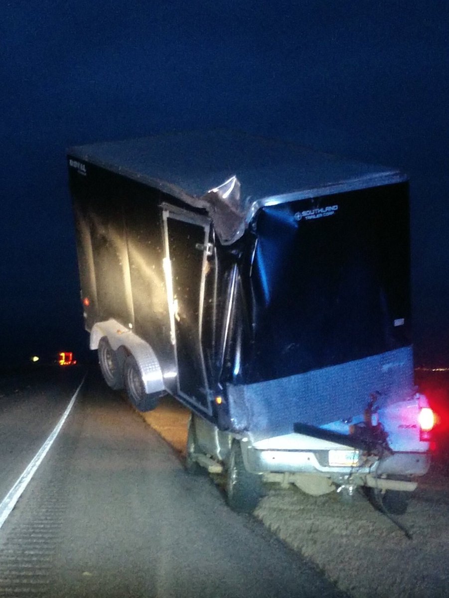 High winds and a lightweight trailer resulted in this unlikely predicament on HWY 385 near the South Dakota border. The trailer was balancing solely on the pickup bed. Chadron based Troopers worked the accident and provided traffic control.