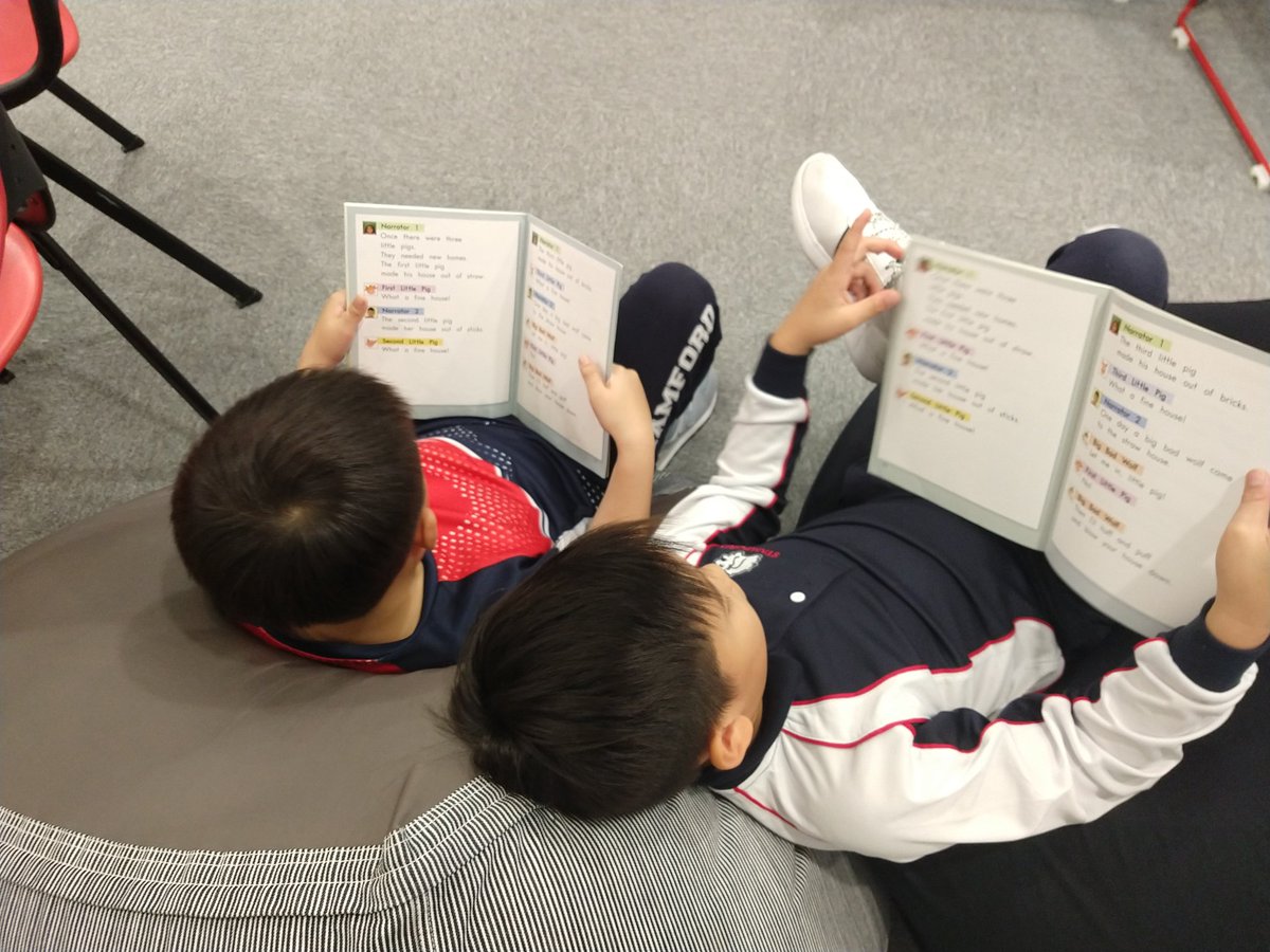 mr_jconrad's tweet photo. These two really enjoyed trying partner reading with a reader's theater text. #StamfordHK #cognitaway https://t.co/zmmFVL8g6r