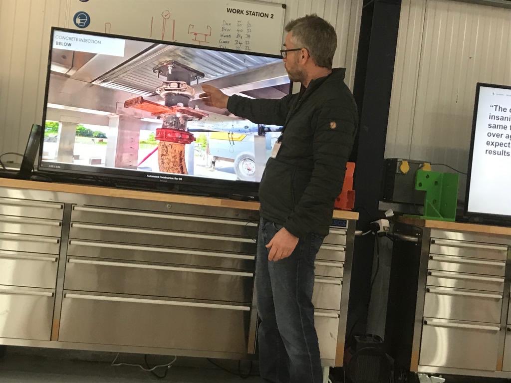 BrydenWood's tweet photo. Martin Wood showing how #concrete injection on Office 1.0 P-DfMA approach means no physical exposure of operatives to the concrete, creating much greater productivity on site. #automatedconstruction #DfMA https://t.co/t4c6sjGOUW