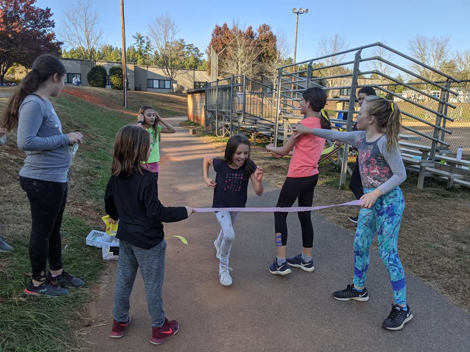 gotrwnc's tweet image. Love the expressions on these girls&apos; faces as their team cheered them across the finish line! Practice 5k is in the books for @BuncombeSchools North Buncombe Elementary School. These girls are ready for the #GirlsontheRun of WNC 5K on Dec. 8! Register at gotrwnc.org/5k.