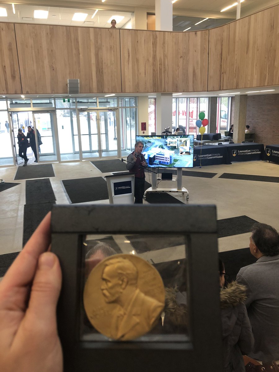 ValMichelutti's tweet photo. In my hand is the Nobel Peace prize. In front of our group, is a captivating presentation by the Director of SNOLAB. Thank you for simplifying the amazing research. #InternationalEducationWeek #LaurentianUniversity https://t.co/nlpLe1tEFj