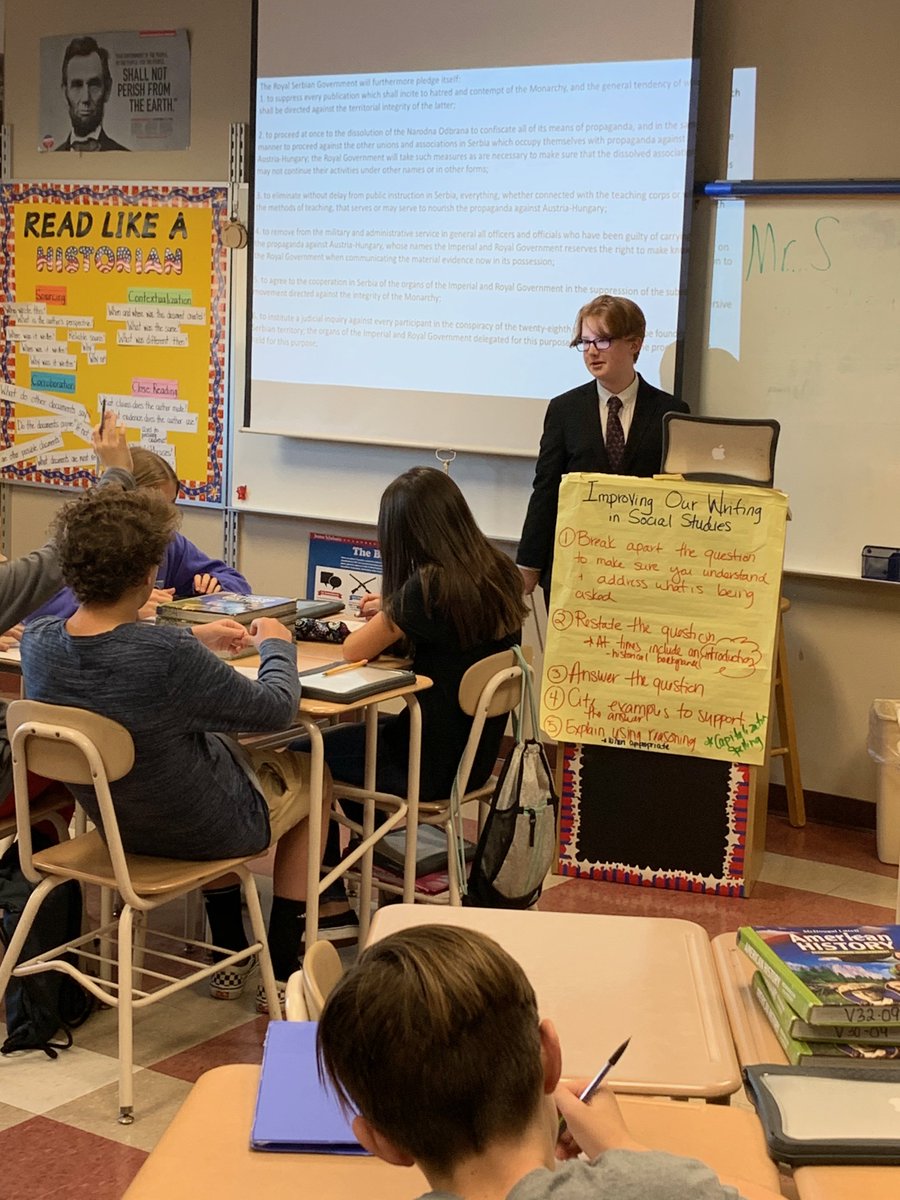 EllermanBridget's tweet photo. Student "Mr. S" asked us if he could teach a lesson on the beginning of WWI.  Here he is teaching his peers.  His hard work and preparation has paid off @BBuda2 @HowellTwpMSS https://t.co/JIRy0ZrU8m