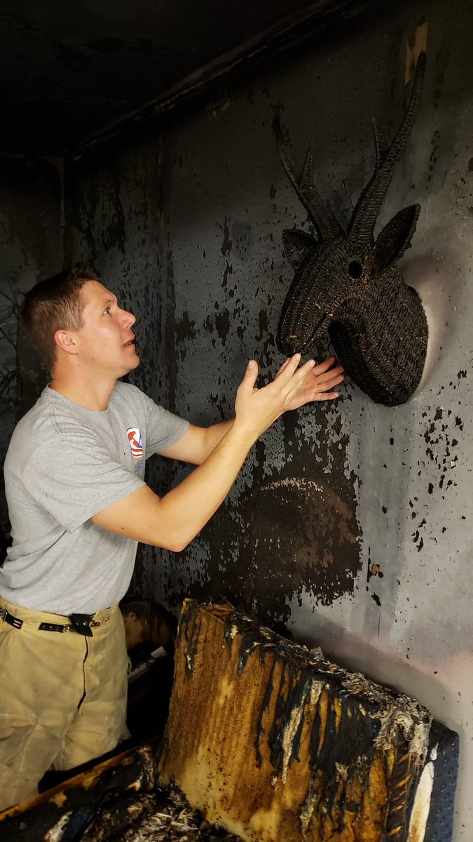 A person named Greg and a wicker deer head named Greg after a Christmas tree fire.