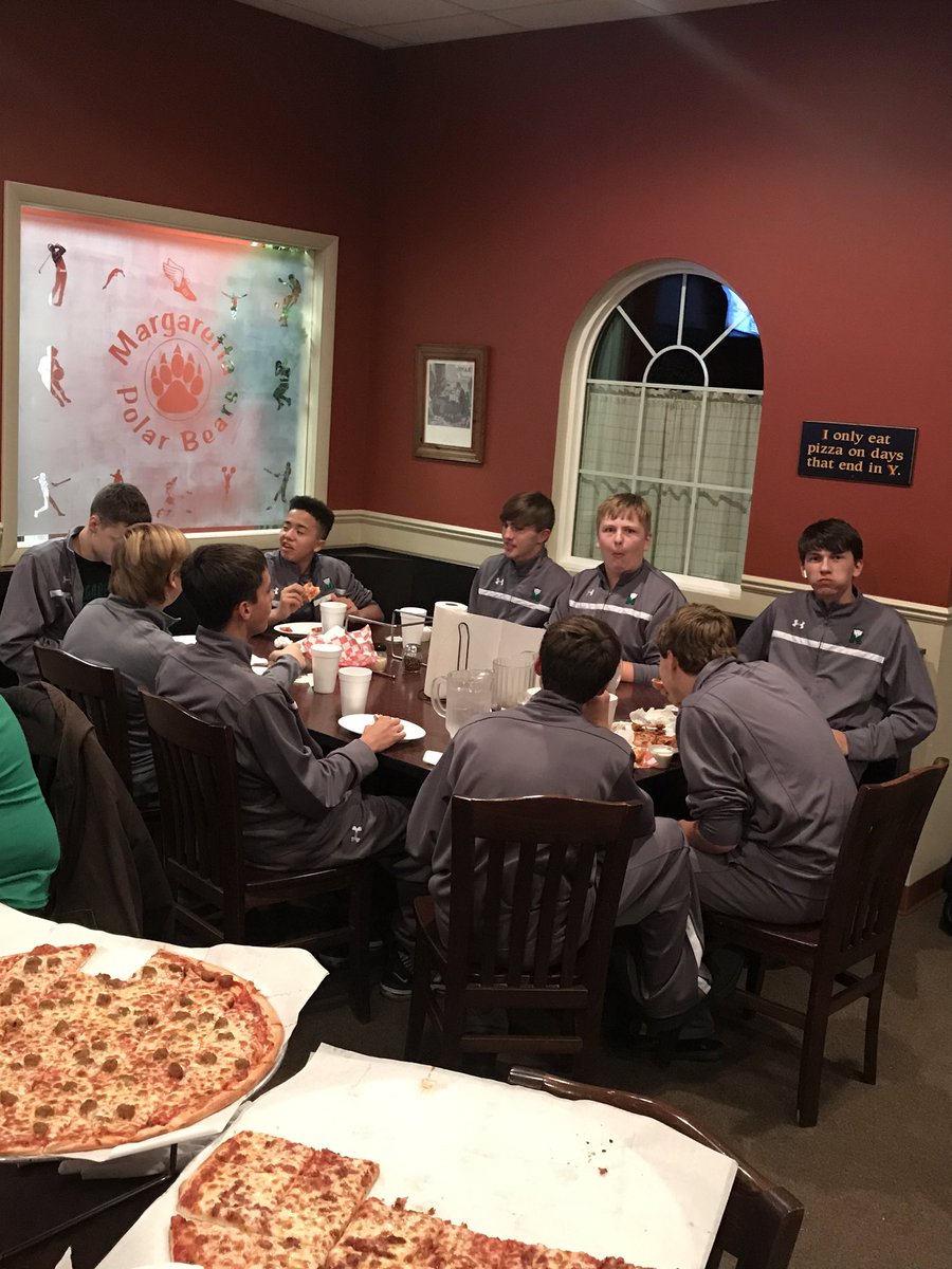 JV Polar Bears enjoying some pizza after scrimmage tonight