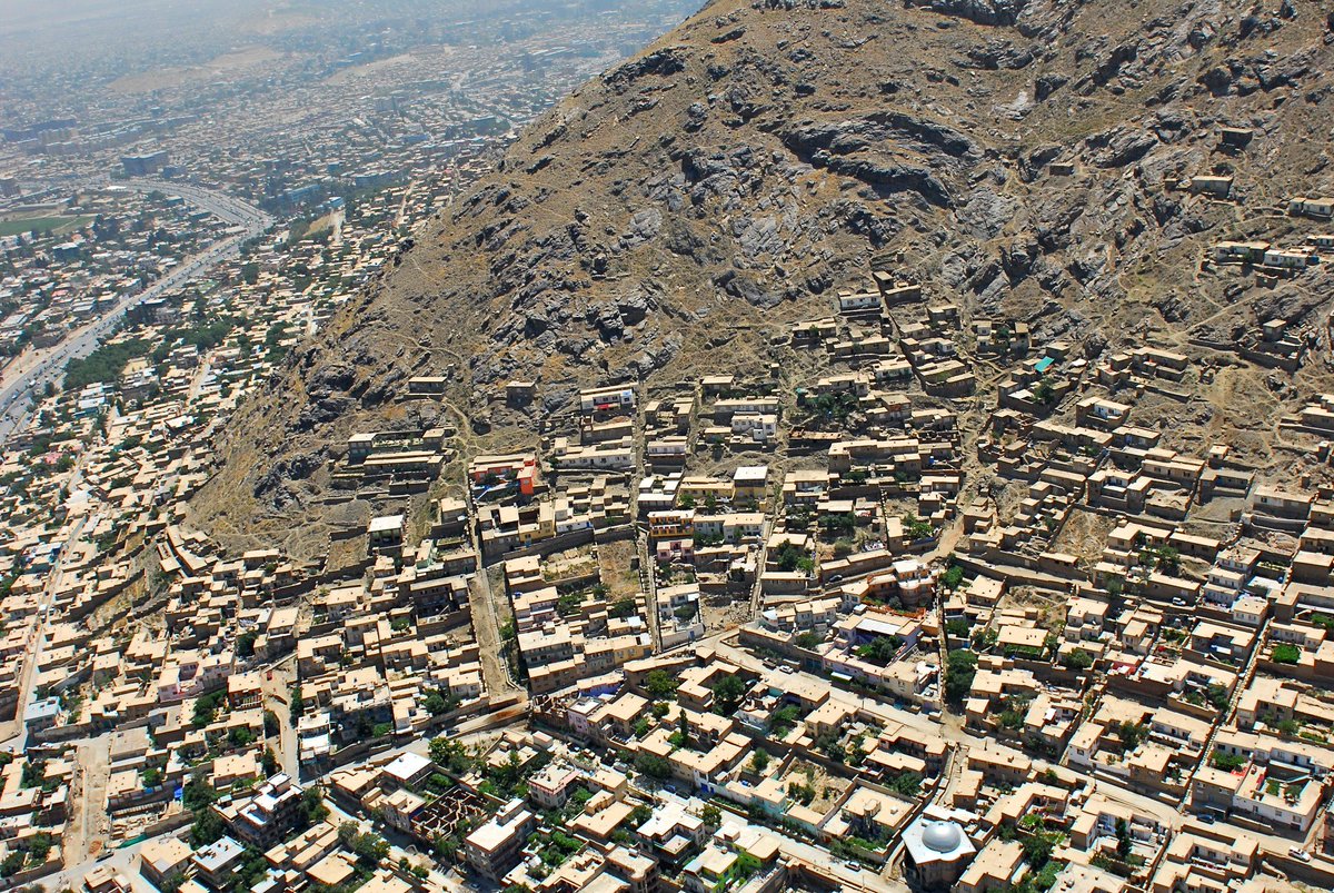 Another example of high density, 1-2 story neighborhoods. This one's in Kabul, Afghanistan. Image by aka4ajax, from  https://commons.wikimedia.org/wiki/File:Kabul_Houses_on_Mountain_side_-_panoramio.jpg The key to high density at low-rise is narrow streets, and not wasting space on parking or front & side yards. 8/