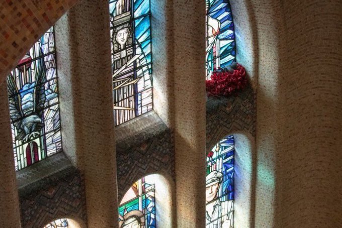 A canny pigeon has been helping itself to poppies placed on the Tomb of the Unknown Soldier at the Australian War Memorial. Its fake poppy nest is built in an alcove beneath a stained glass window. An uncanny symbol of hope in a bleak world #RemembranceDay