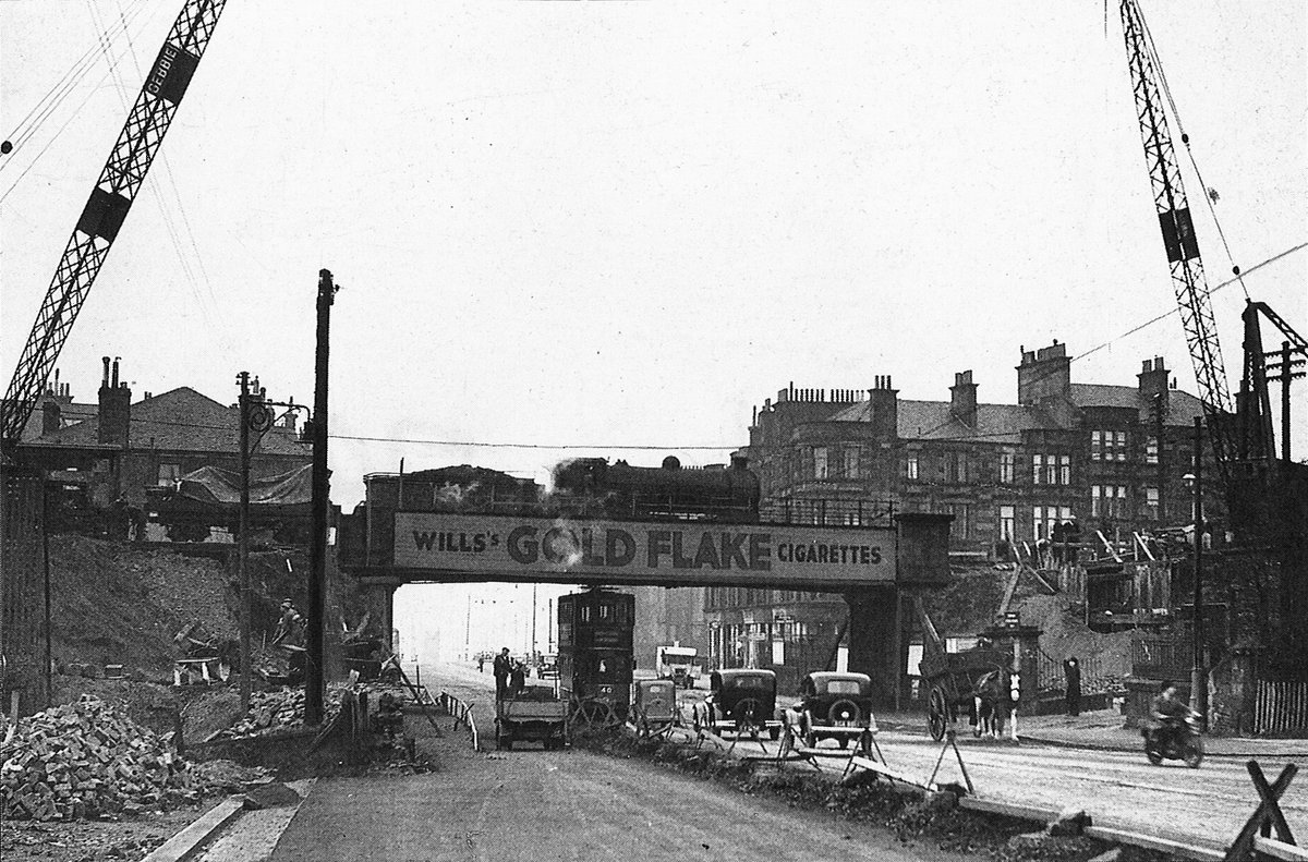 PastGlasgow's tweet photo. Two views of Anniesland station bridge, taken a year apart. The first shows the dismantling of the old bridge in 1936, while the second shows the new bow string bridge by Sir William Arrol &amp; Co nearing completion in 1937. https://t.co/dQHkPrYPVj